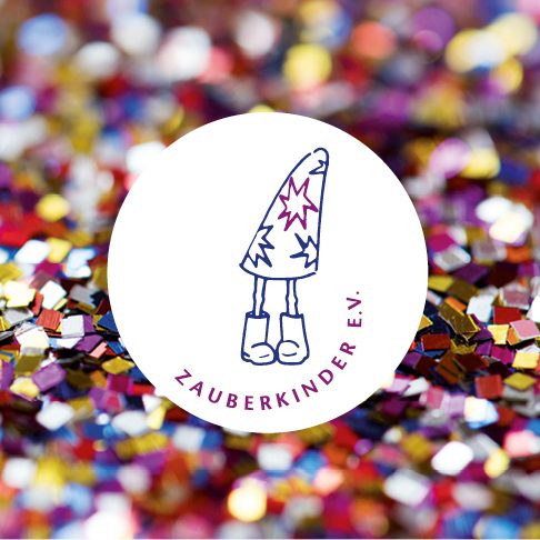 Logo von Zauberkinder e.V. auf glitzerndem Hintergrund.